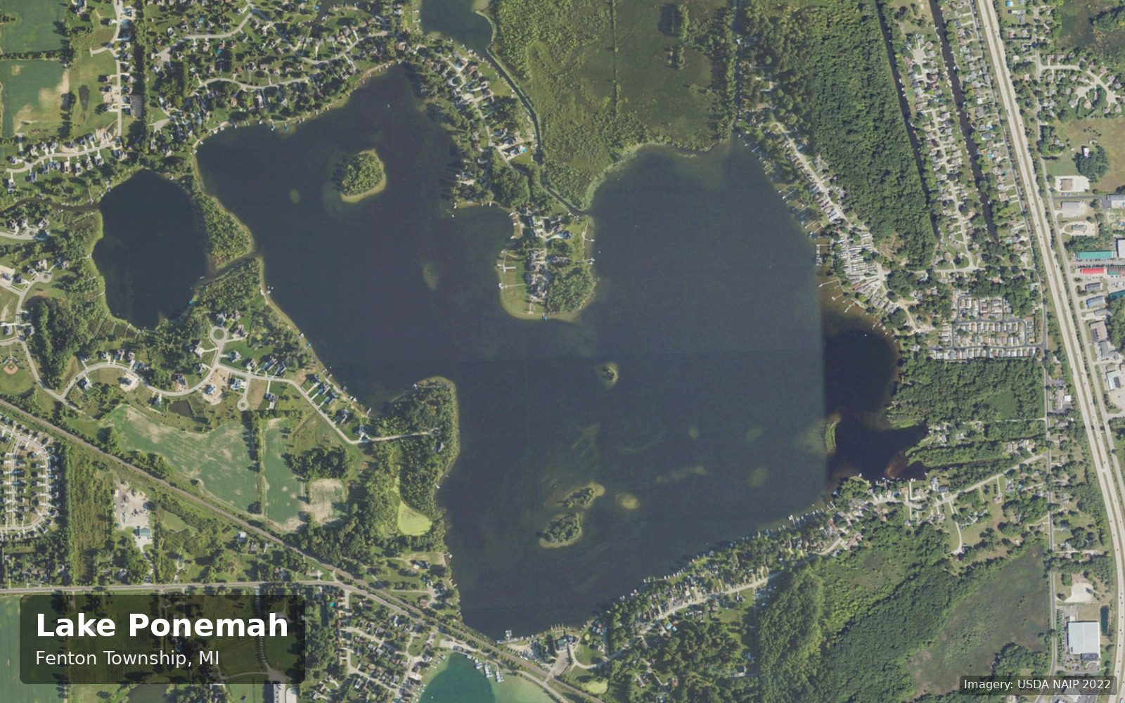 Labeled aerial view of Lake Ponemah in Fenton Township, Michigan, with its islands, channels and shoreline neighborhoods